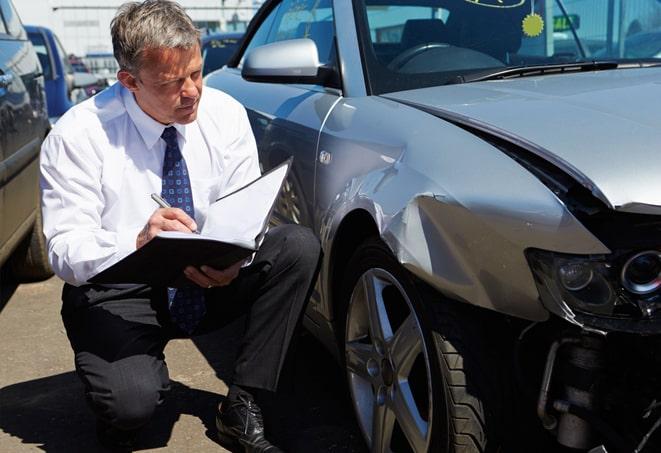 person filling out online form for car insurance quote